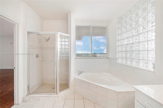 1650 Coral Way Unit Ph-9, Miami, FL 33145 - bathroom featuring a bath, a stall shower, vanity, and tile patterned floors