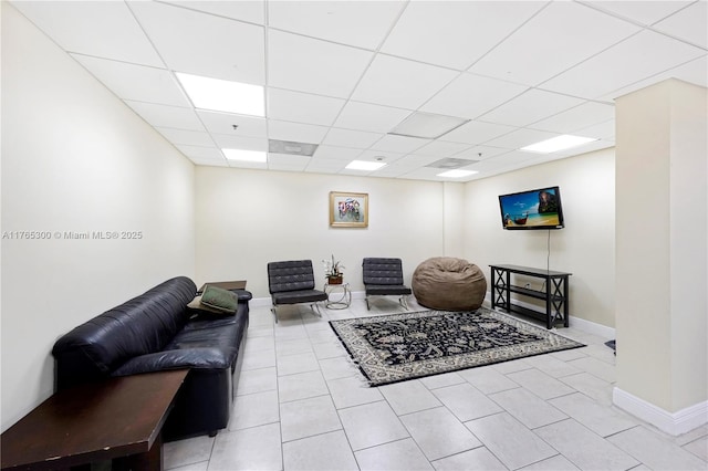 1650 Coral Way Unit Ph-9, Miami, FL 33145 - living room with light tile patterned floors, a paneled ceiling, and baseboards