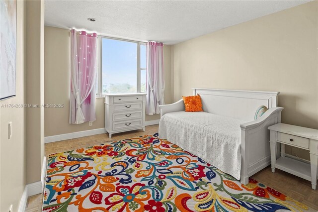 4400 Hillcrest Dr Unit 720C, Hollywood, FL 33021 - bedroom featuring baseboards and a textured ceiling