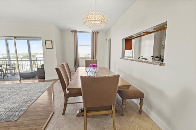 4400 Hillcrest Dr Unit 720C, Hollywood, FL 33021 - tiled dining space with a chandelier and baseboards