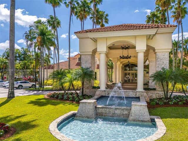 9805 NW 52nd St Unit 215, Doral, FL 33178 - exterior space featuring a lawn