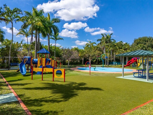 9805 NW 52nd St Unit 215, Doral, FL 33178 - community playground with a lawn