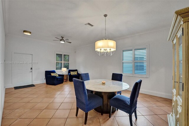 dining space with baseboards, a ceiling fan, visible vents, and light tile patterned floors