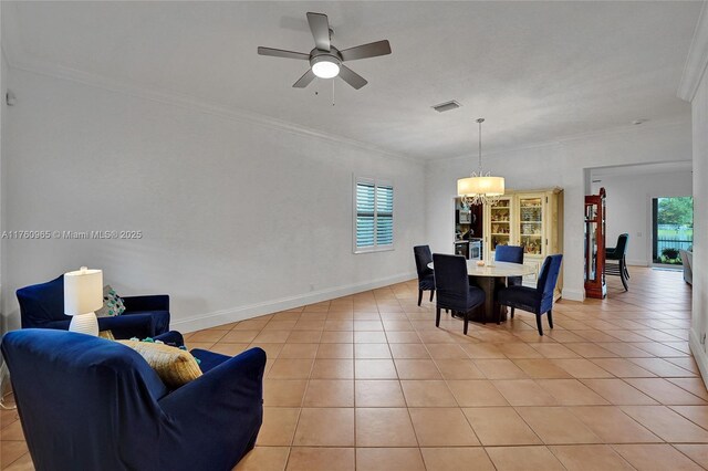 dining area with ornamental molding, ceiling fan, visible vents, and light tile patterned floors