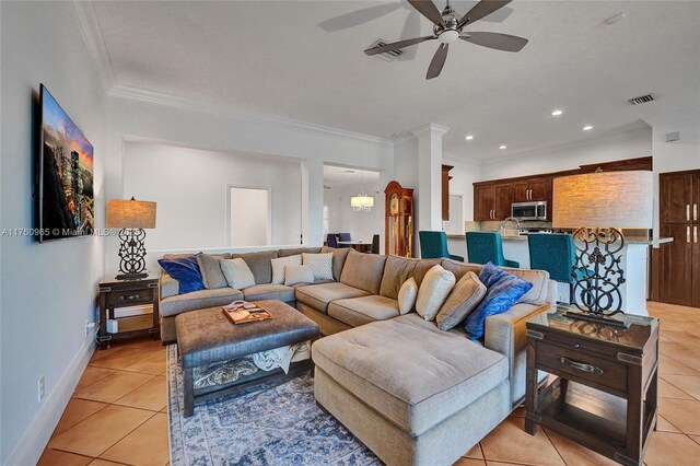 dining room featuring baseboards, an inviting chandelier, ornamental molding, and light tile patterned floors