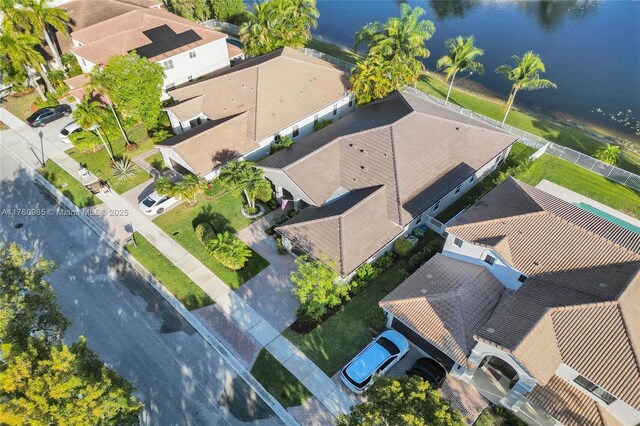 bird's eye view with a residential view and a water view