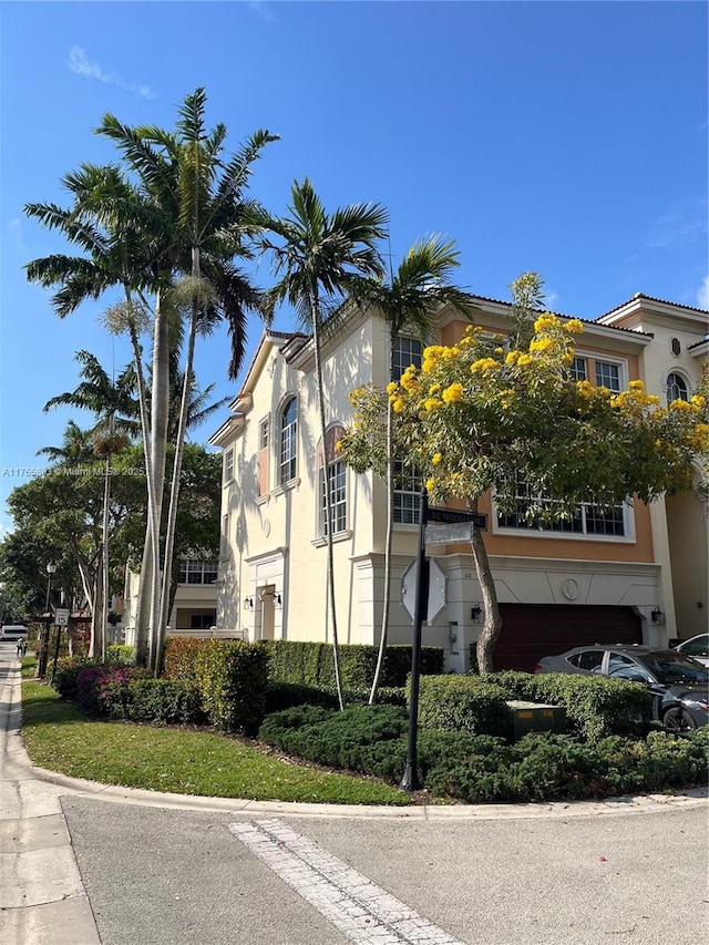 616 NE Venezia Ln Unit 616, Boca Raton, FL 33487 - view of property with a garage
