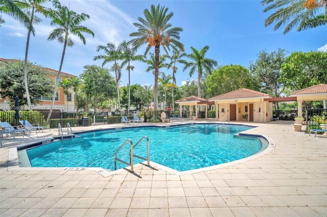 616 NE Venezia Ln Unit 616, Boca Raton, FL 33487 - community pool with a gazebo, a patio area, and fence