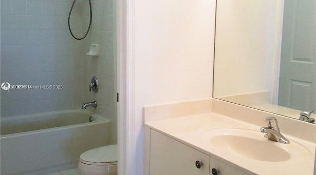full bath with vanity, toilet, and washtub / shower combination