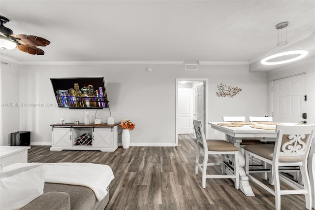 6831 SW 44th St Unit 112, Miami, FL 33155 - living room featuring dark wood-style flooring, visible vents, baseboards, and ornamental molding