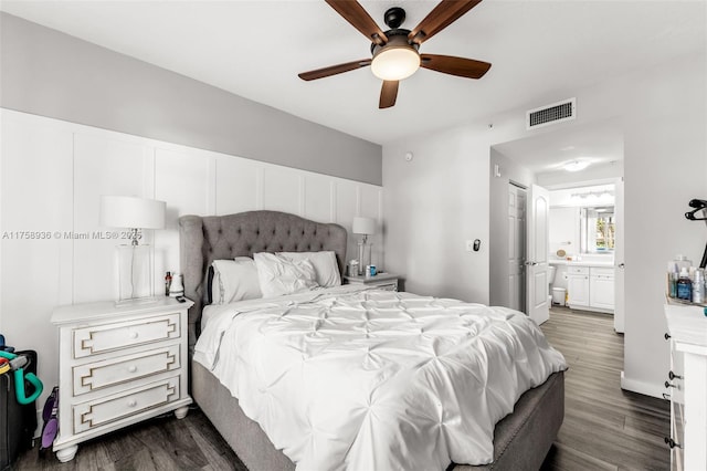6831 SW 44th St Unit 112, Miami, FL 33155 - bedroom featuring dark wood finished floors, a ceiling fan, visible vents, and connected bathroom