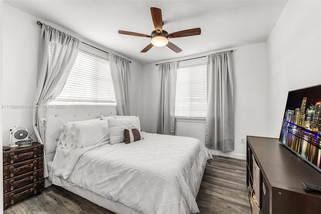 6831 SW 44th St Unit 112, Miami, FL 33155 - bedroom with multiple windows, dark wood-type flooring, and a ceiling fan