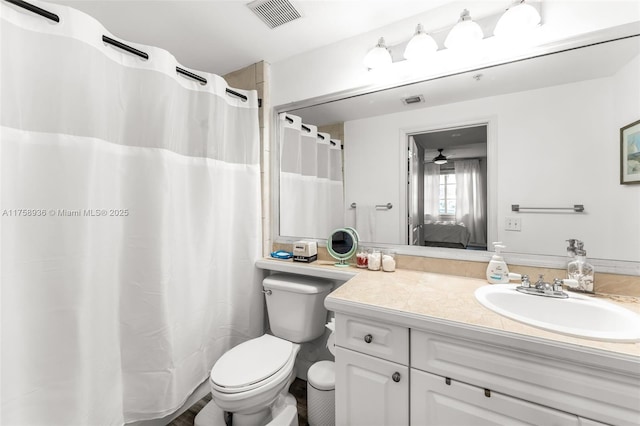 6831 SW 44th St Unit 112, Miami, FL 33155 - ensuite bathroom with visible vents, toilet, ensuite bath, ceiling fan, and vanity