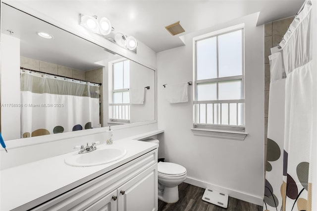 6831 SW 44th St Unit 112, Miami, FL 33155 - full bathroom with visible vents, toilet, wood finished floors, baseboards, and vanity