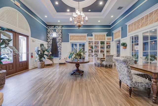 6831 SW 44th St Unit 112, Miami, FL 33155 - foyer featuring an inviting chandelier, wood finished floors, french doors, and a wainscoted wall