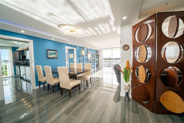 8530 Byron Ave Unit 502, Miami Beach, FL 33141 - dining area with healthy amount of natural light, recessed lighting, expansive windows, and wood finished floors