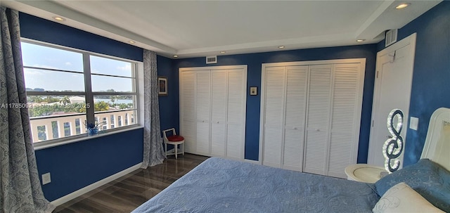 8530 Byron Ave Unit 502, Miami Beach, FL 33141 - bedroom featuring visible vents, wood finished floors, baseboards, multiple closets, and recessed lighting