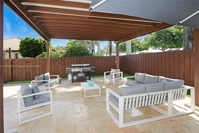 view of patio / terrace featuring area for grilling, a fenced backyard, and an outdoor hangout area