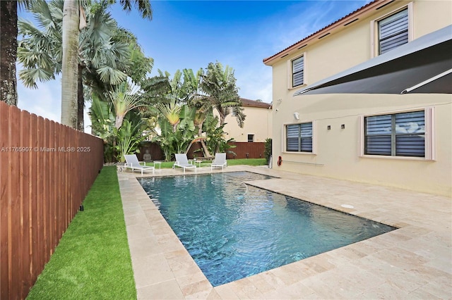 view of pool featuring a fenced in pool, a patio, and a fenced backyard