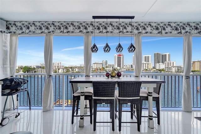 410 Golden Isles Dr Unit 603, Hallandale Beach, FL 33009 - tiled dining area featuring a city view and a water view