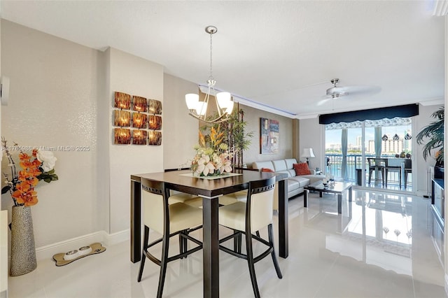 410 Golden Isles Dr Unit 603, Hallandale Beach, FL 33009 - dining room with light tile patterned flooring, a notable chandelier, and baseboards