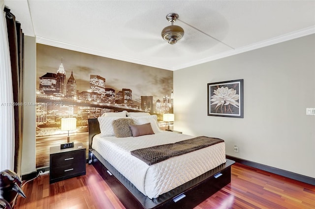 410 Golden Isles Dr Unit 603, Hallandale Beach, FL 33009 - bedroom featuring ornamental molding, ceiling fan, baseboards, and wood finished floors