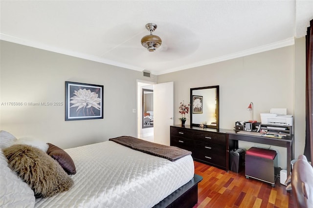 410 Golden Isles Dr Unit 603, Hallandale Beach, FL 33009 - bedroom featuring visible vents, ornamental molding, a ceiling fan, and wood finished floors
