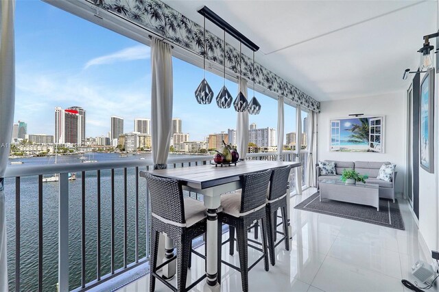 410 Golden Isles Dr Unit 603, Hallandale Beach, FL 33009 - sunroom / solarium featuring a view of city