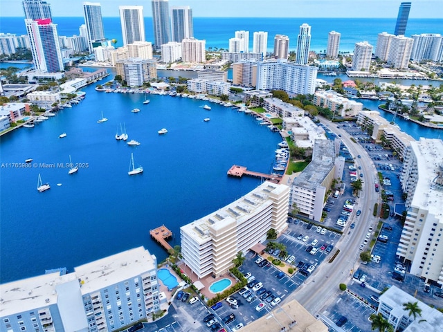 410 Golden Isles Dr Unit 603, Hallandale Beach, FL 33009 - drone / aerial view with a city view and a water view