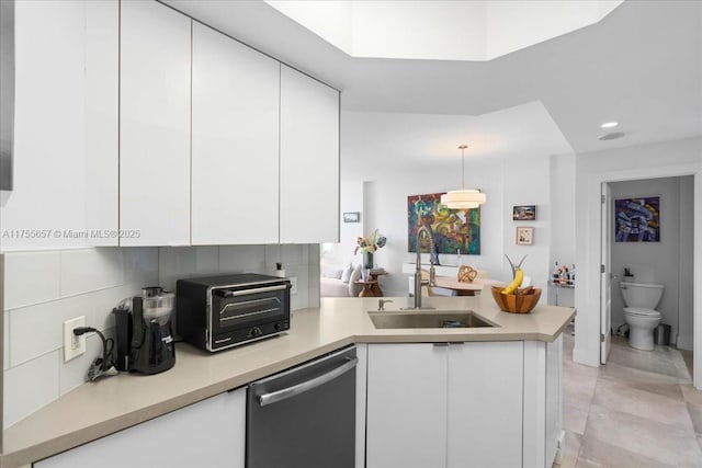 888 Brickell Key Dr Unit 1502, Miami, FL 33131 - kitchen featuring dishwasher, a peninsula, white cabinetry, light countertops, and recessed lighting