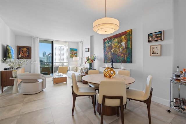 888 Brickell Key Dr Unit 1502, Miami, FL 33131 - dining space with a wall of windows and light tile patterned floors