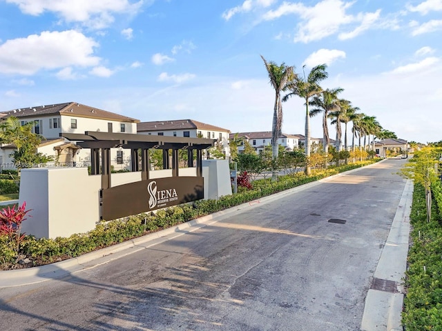 view of road featuring curbs and a residential view