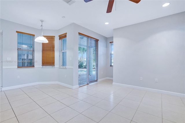 empty room with baseboards, light tile patterned floors, recessed lighting, and a ceiling fan