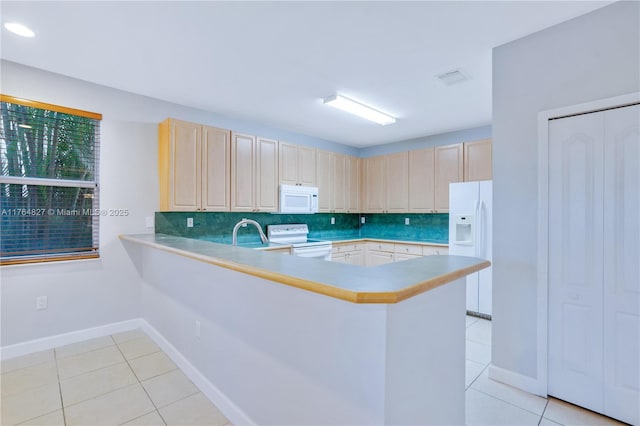 kitchen featuring white appliances, light tile patterned floors, backsplash, and a peninsula