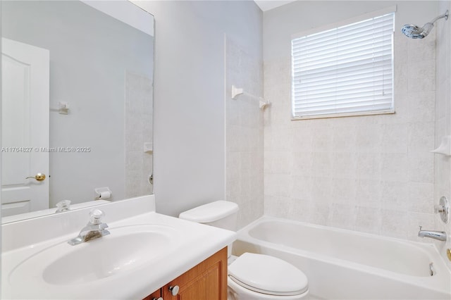 bathroom featuring vanity, toilet, and bathing tub / shower combination