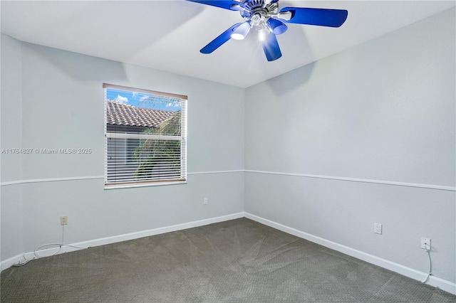 empty room featuring baseboards, carpet floors, and a ceiling fan