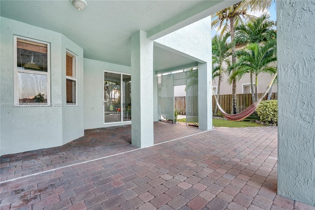 view of patio / terrace featuring fence