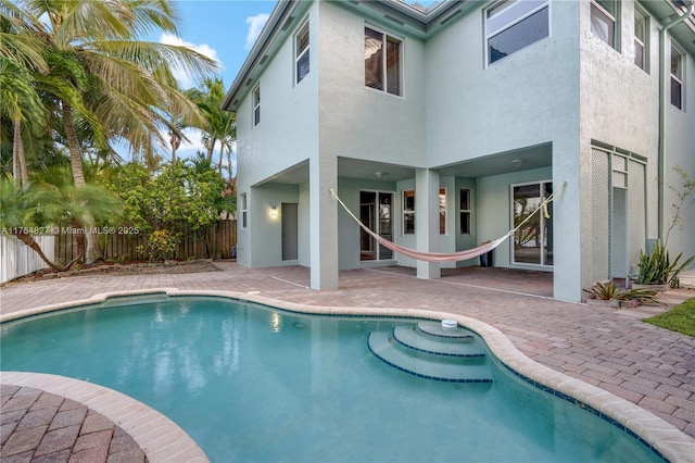 view of pool with a patio, fence, and a fenced in pool