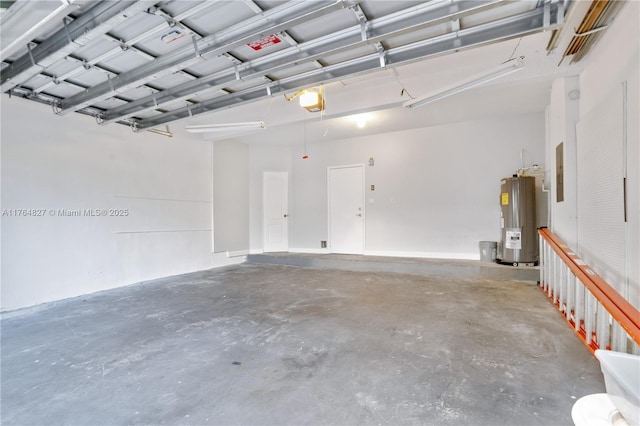 garage featuring water heater and a garage door opener