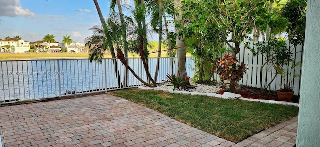 property view of water featuring a residential view and fence