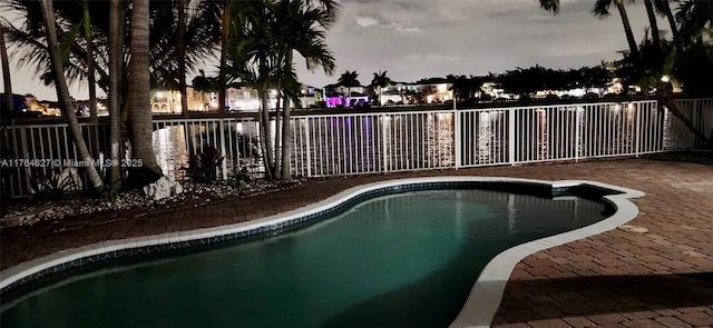 view of swimming pool featuring a fenced in pool and a fenced backyard