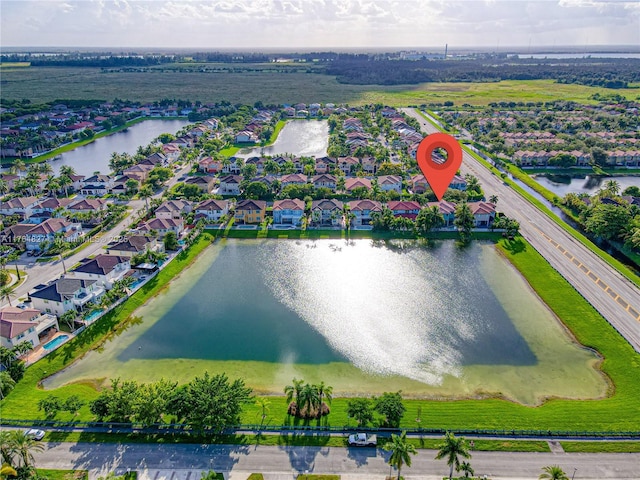 bird's eye view with a residential view and a water view