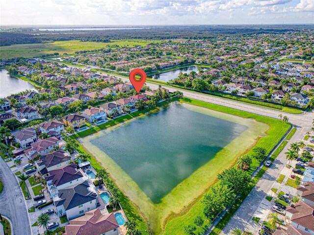 bird's eye view with a residential view and a water view