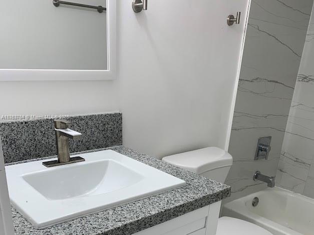13390 NE 7th Ave Unit 308, North Miami, FL 33161 - bathroom with vanity, toilet, and shower / bathtub combination