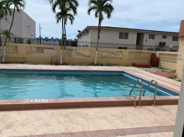 13390 NE 7th Ave Unit 308, North Miami, FL 33161 - pool featuring fence