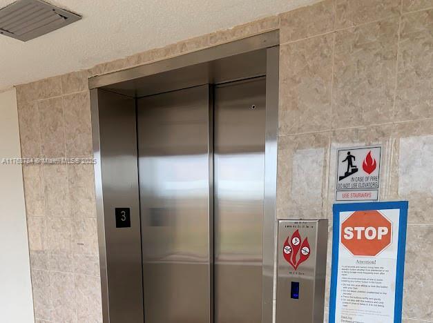 13390 NE 7th Ave Unit 308, North Miami, FL 33161 - interior details featuring elevator