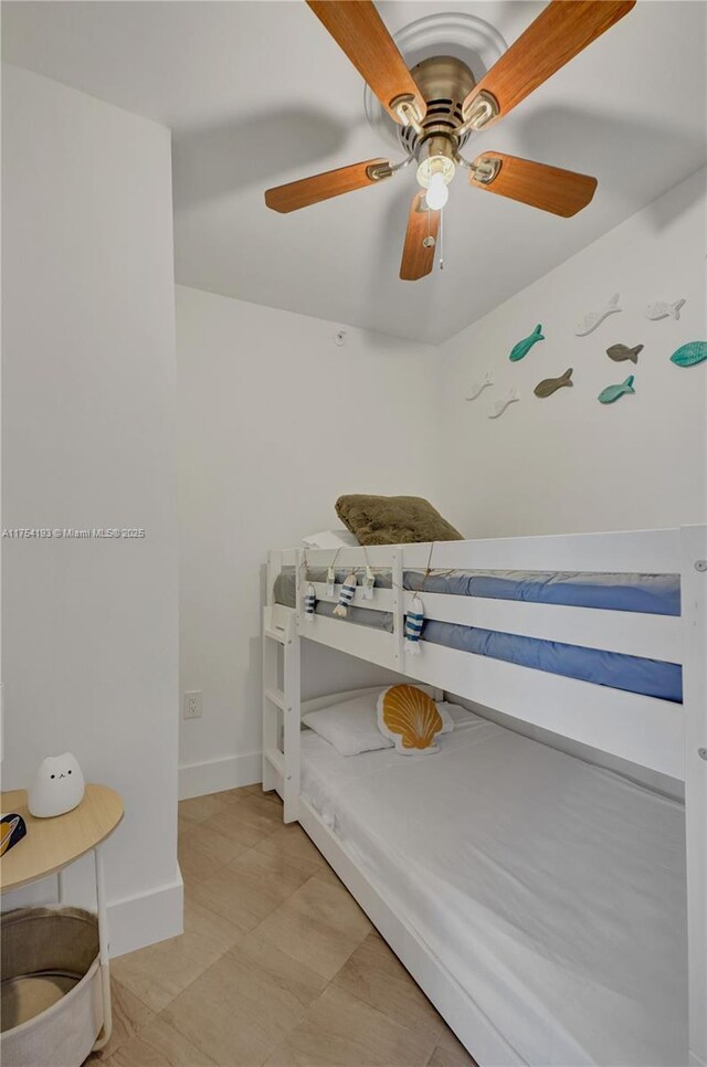 6820 Indian Creek Dr Unit 9A, Miami Beach, FL 33141 - unfurnished bedroom featuring a ceiling fan and baseboards