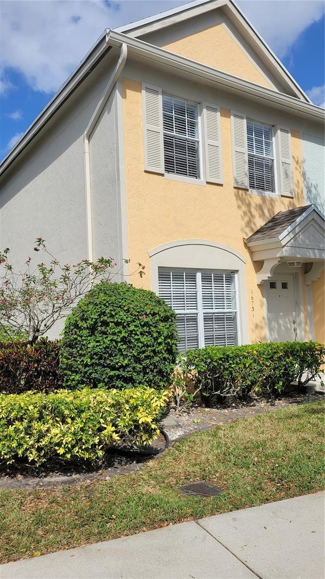 16731 Hemingway Dr, Weston, FL 33326 - view of side of home featuring stucco siding