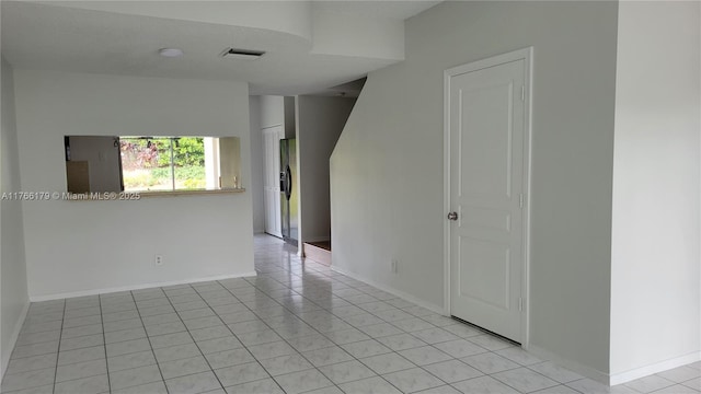 16731 Hemingway Dr, Weston, FL 33326 - spare room with light tile patterned flooring and baseboards