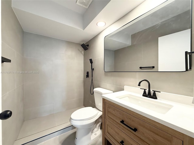 1770 E Las Olas Blvd Unit 302, Fort Lauderdale, FL 33301 - bathroom featuring tiled shower, vanity, and toilet